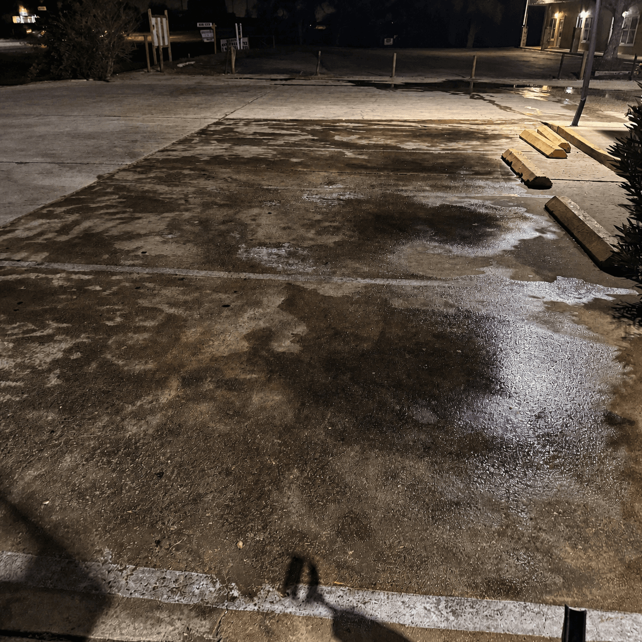 Commercial parking bay before Torres Pressure Washing